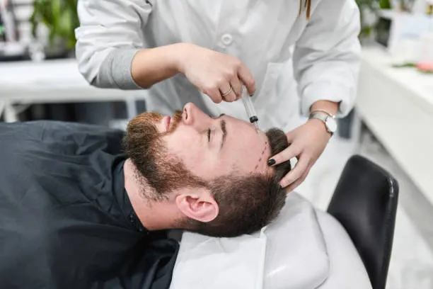 How much is hair transplant; a doctor performing the surgical process
