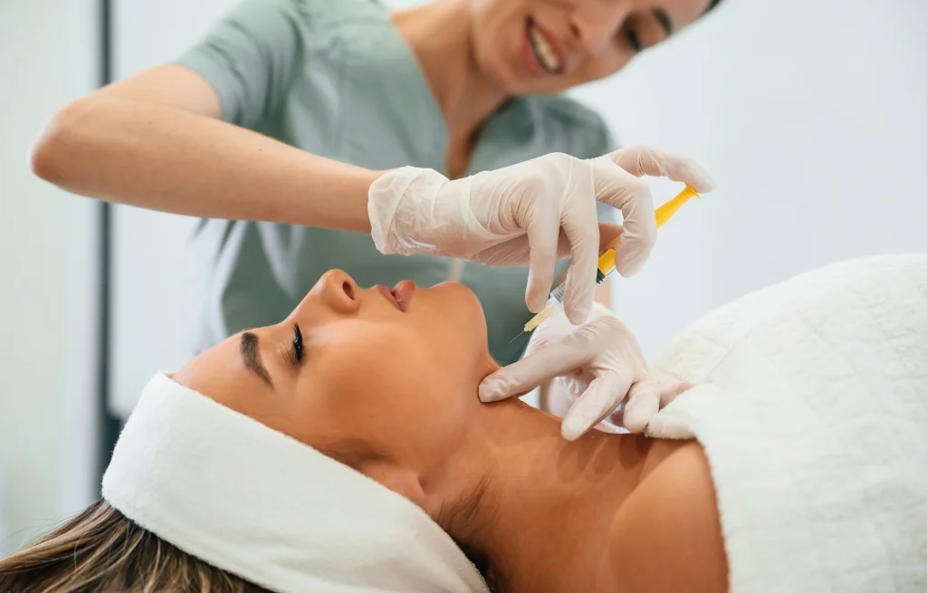 Aesthetic specialist performing botox treatment along the jawline for contouring