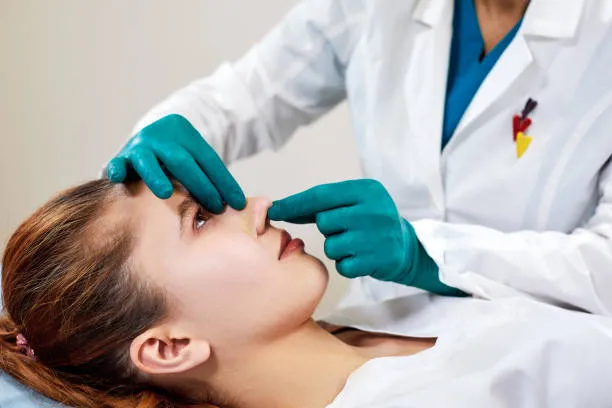 Patient attending a rhinoplasty consultation in Mexico with a board-certified plastic surgeon