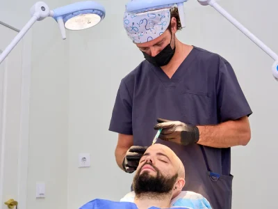 Doctor administering scalp injections to a patient as part of advanced hair loss solutions to stimulate hair growth